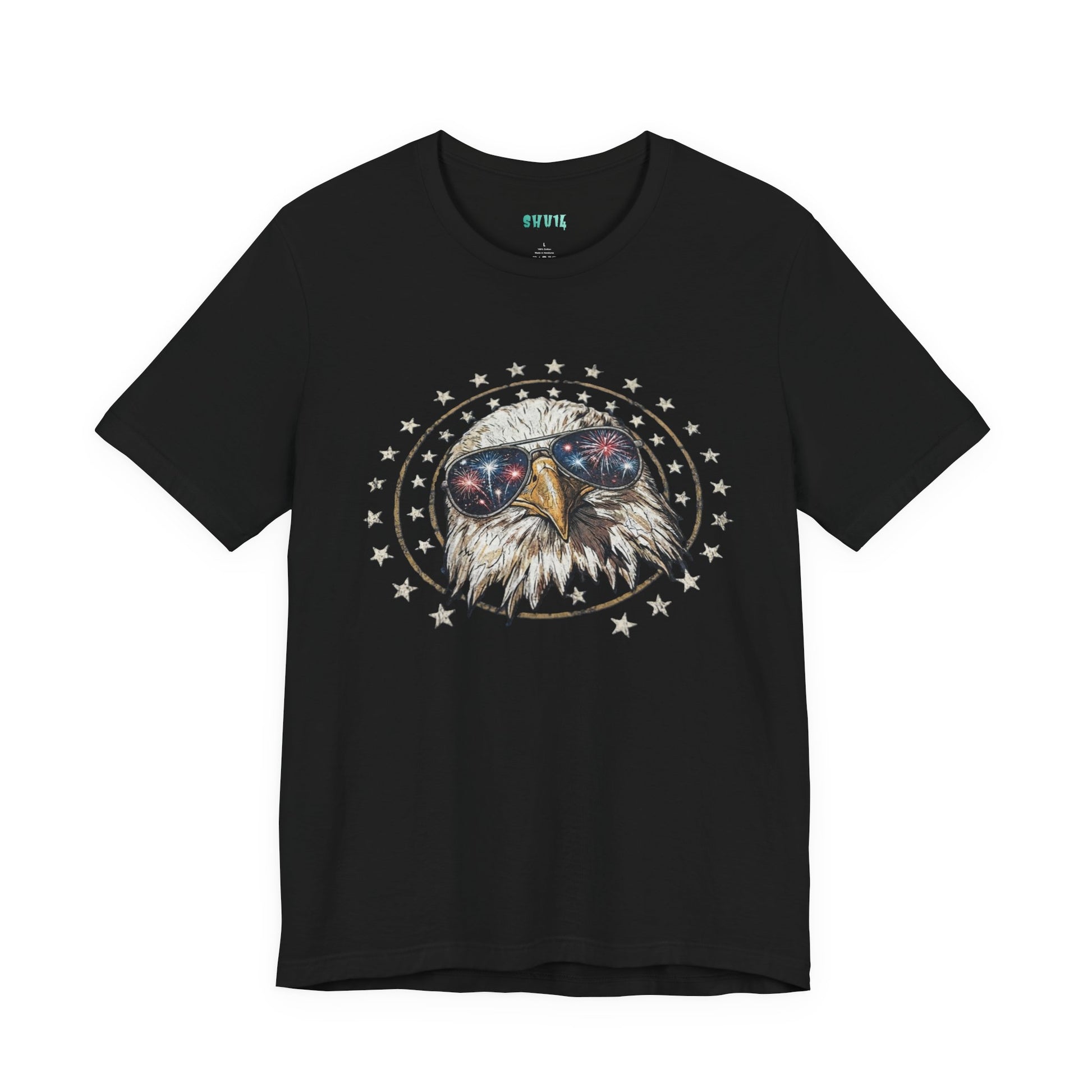 Close-up graphic design of a majestic bald eagle wearing black aviator sunglasses that reflect red, white, and blue fireworks, encircled by a distressed ring of stars against a solid black background.