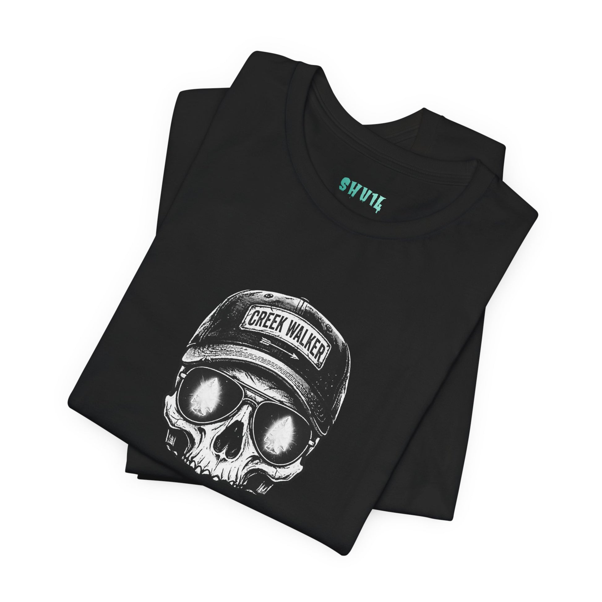 Distressed human skull graphic on a black shirt wearing a Creek Walker baseball cap and aviator sunglasses reflecting a glowing white arrowhead.