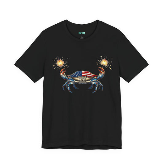 Graphic artwork of a detailed blue crab with an American flag pattern on its shell, holding two glowing, lit sparkler fireworks in its claws against a black background.