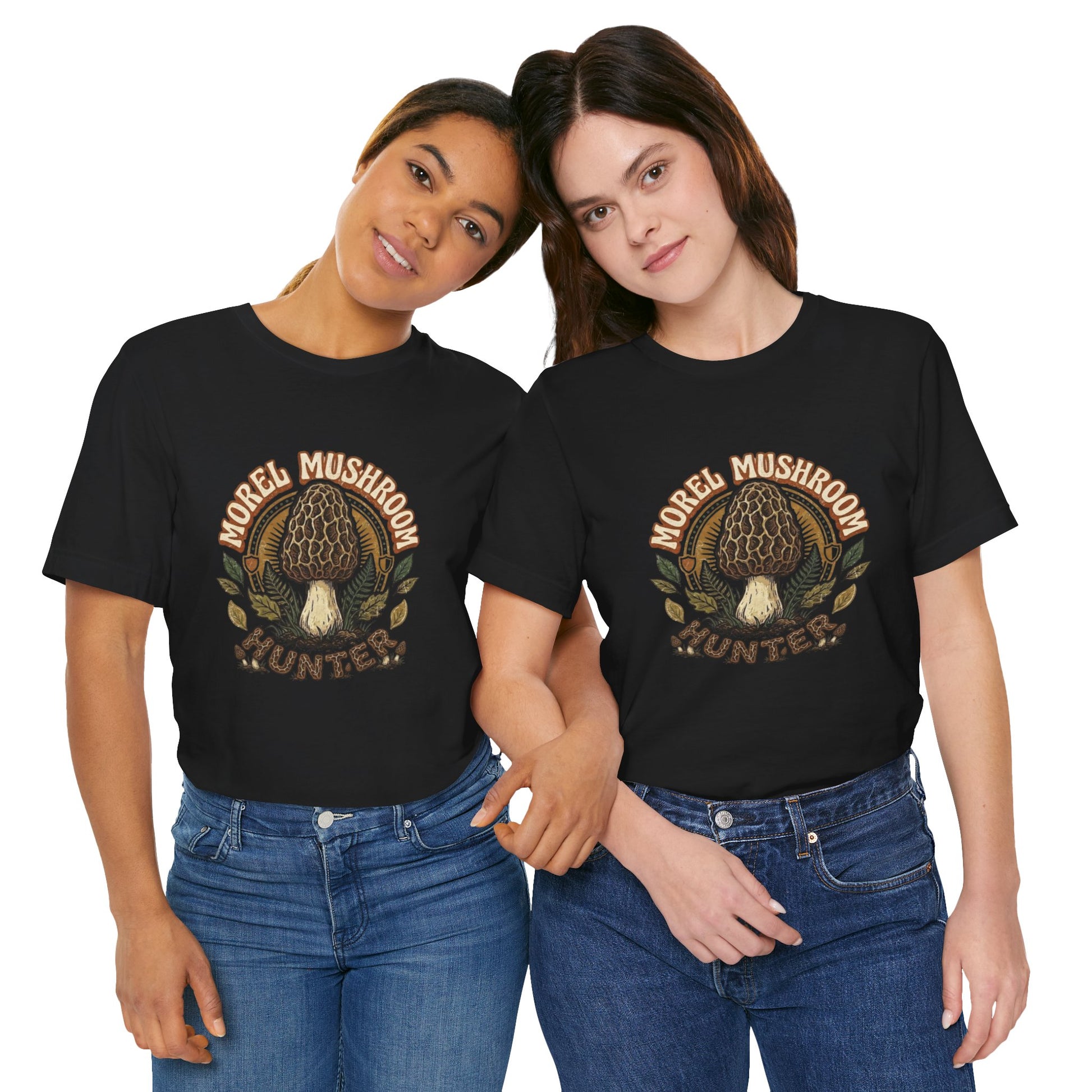 Vintage circular emblem graphic featuring a detailed morel mushroom surrounded by ferns, leaves, and text reading Morel Mushroom Hunter on a black t-shirt.