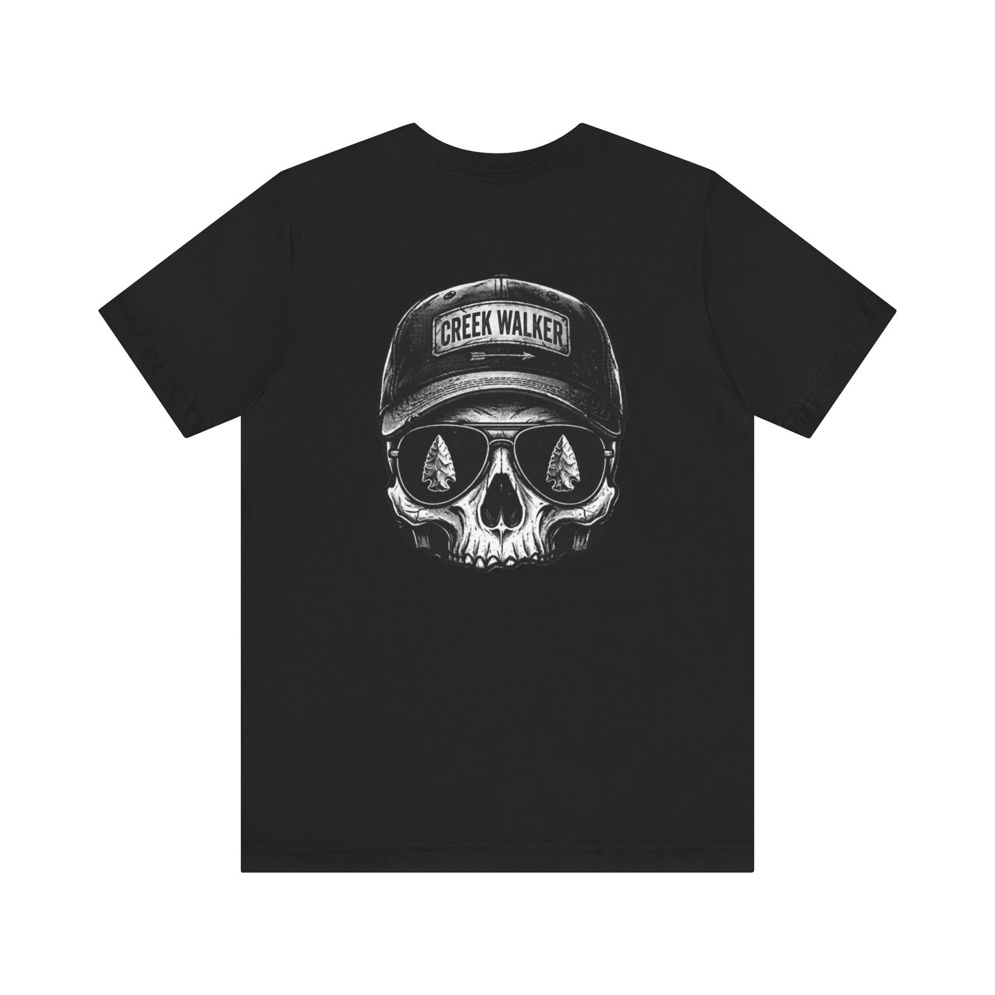 Distressed monochrome graphic on a black shirt showing a human skull wearing a baseball hat with "Creek Walker" written on it and aviator sunglasses that reflect ancient arrowheads.