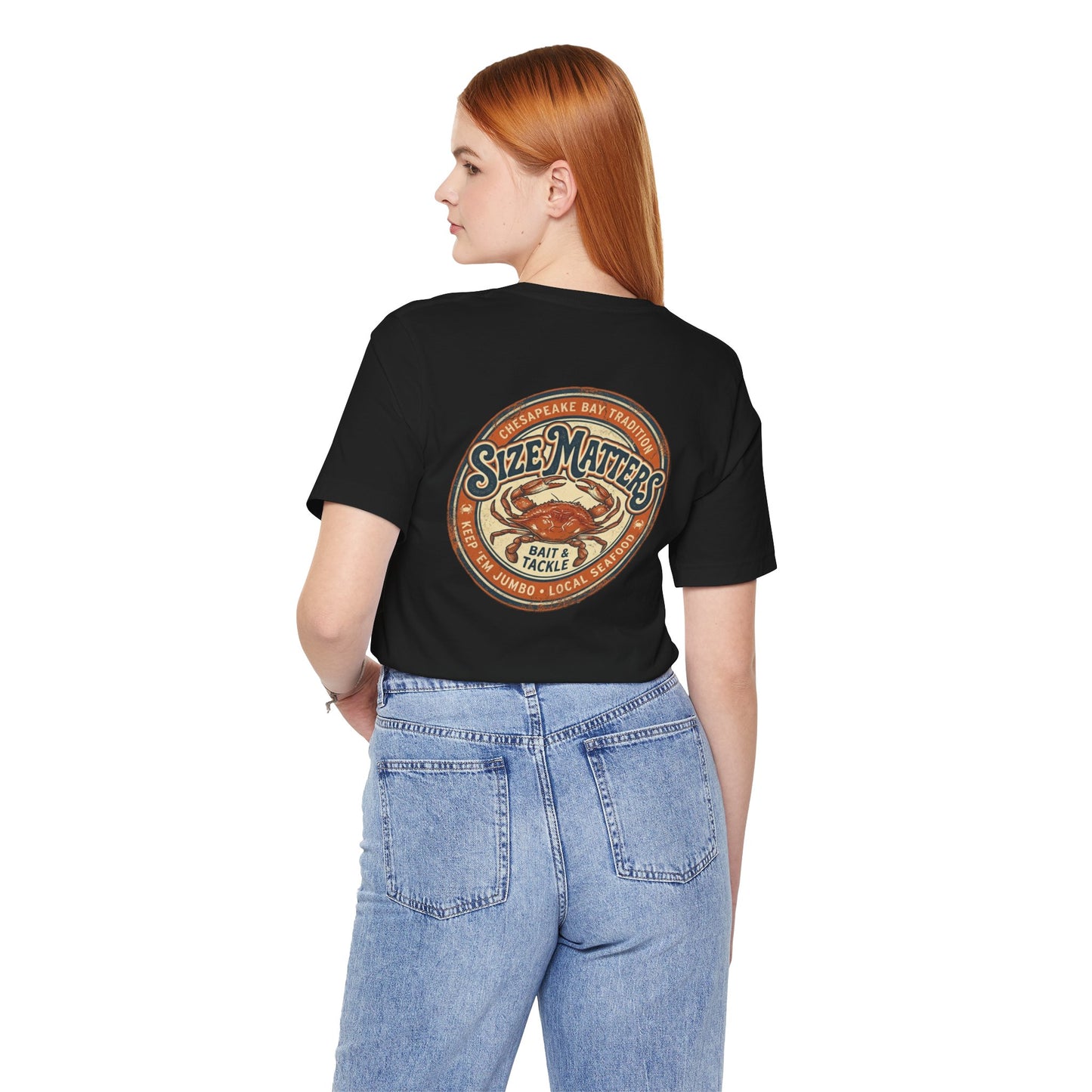 Circular vintage distressed emblem on a black t-shirt featuring a large blue crab and text reading "Chesapeake Bay Tradition, Size Matters, Bait & Tackle, Keep 'Em Jumbo, Local Seafood".